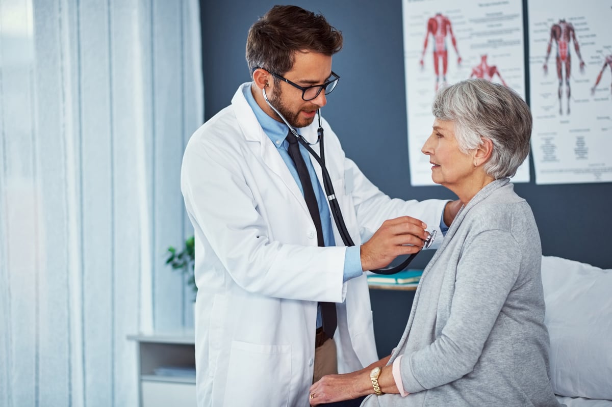 Shot of a doctor examining a senior patient with a stethoscope in a clinic